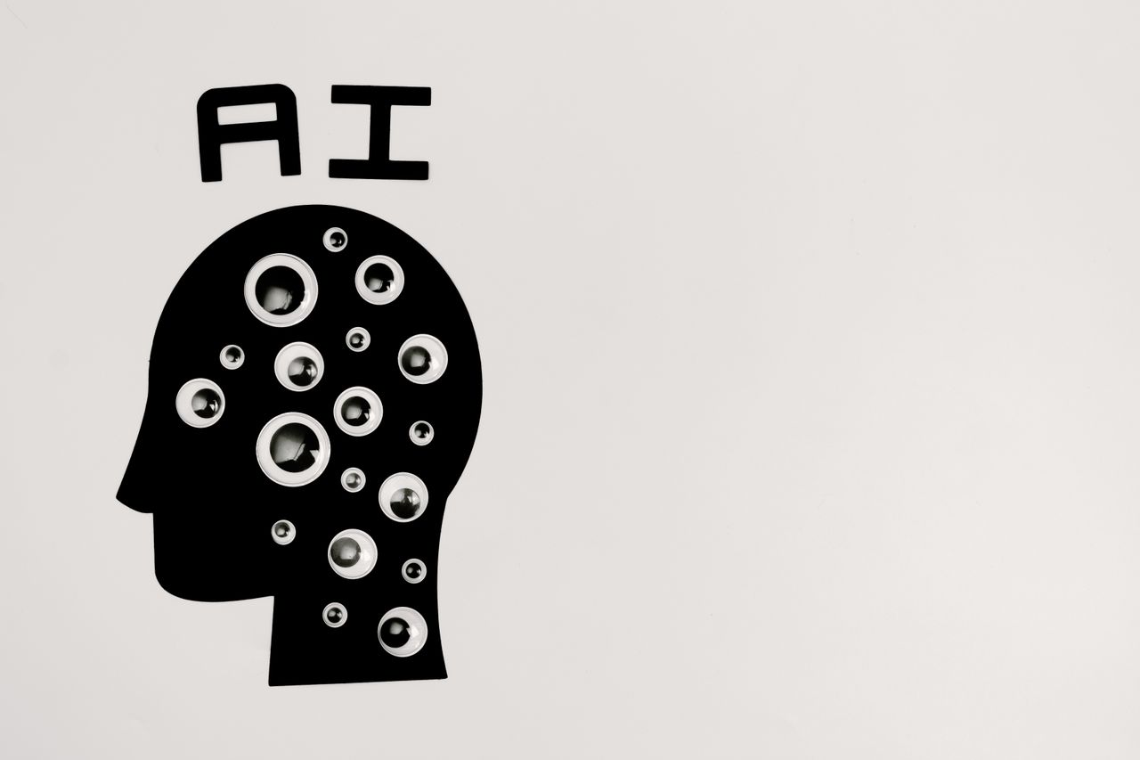 Responsible AI: Why Every Business Needs a Governance Framework Before Deploying AI Abstract illustration of AI with silhouette head full of eyes, symbolizing observation and technology.